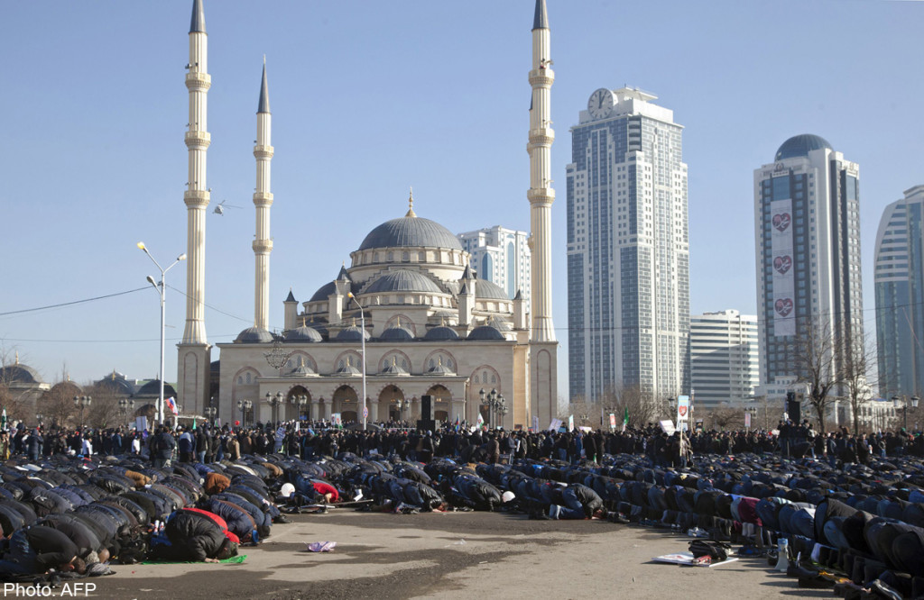 Muslims pray as they take part in a rally against the publication of cartoons of the Prophet Mohammed by French weekly Charlie Hebdo, in the Chechen capital of Grozny on January 19, 2015. Tens of thousands of people rallied on January 19, 2015 at a state-sponsored protest in Russia's Muslim North Caucasus province of Chechnya, against the January 14 publication of Prophet Mohammed cartoons on the cover of the weekly's first issue following the deadly attack on its Paris office by two jihadist brothers. AFP PHOTO / YELENA FITKULINA