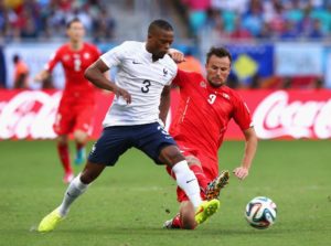 SALVADOR, BRAZIL - JUNE 20: Patrice Evra of France and Haris Seferovic of Switzerland compete for the ball during the 2014 FIFA World Cup Brazil Group E match between Switzerland and France at Arena Fonte Nova on June 20, 2014 in Salvador, Brazil. (Photo by Adam Pretty/Getty Images)